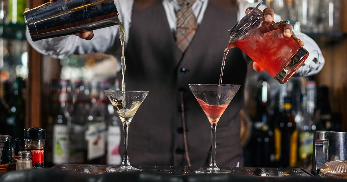 Double pouring bartender